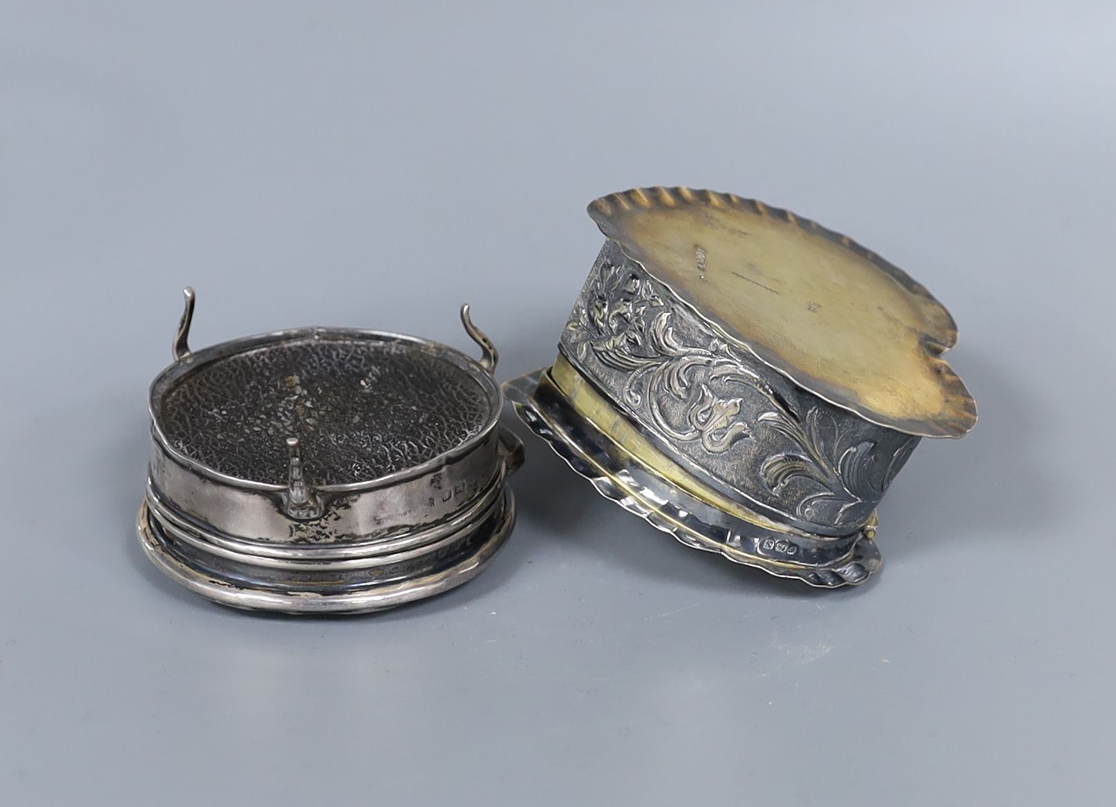 A George V silver and tortoiseshell pique circular trinket box, 71mm and a late Victorian embossed silver heart shaped box, import marks for London, 1888, 80mm.